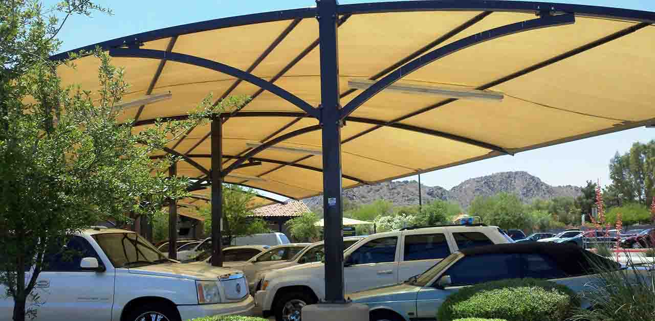 Yellow shade structure covering a parking lot