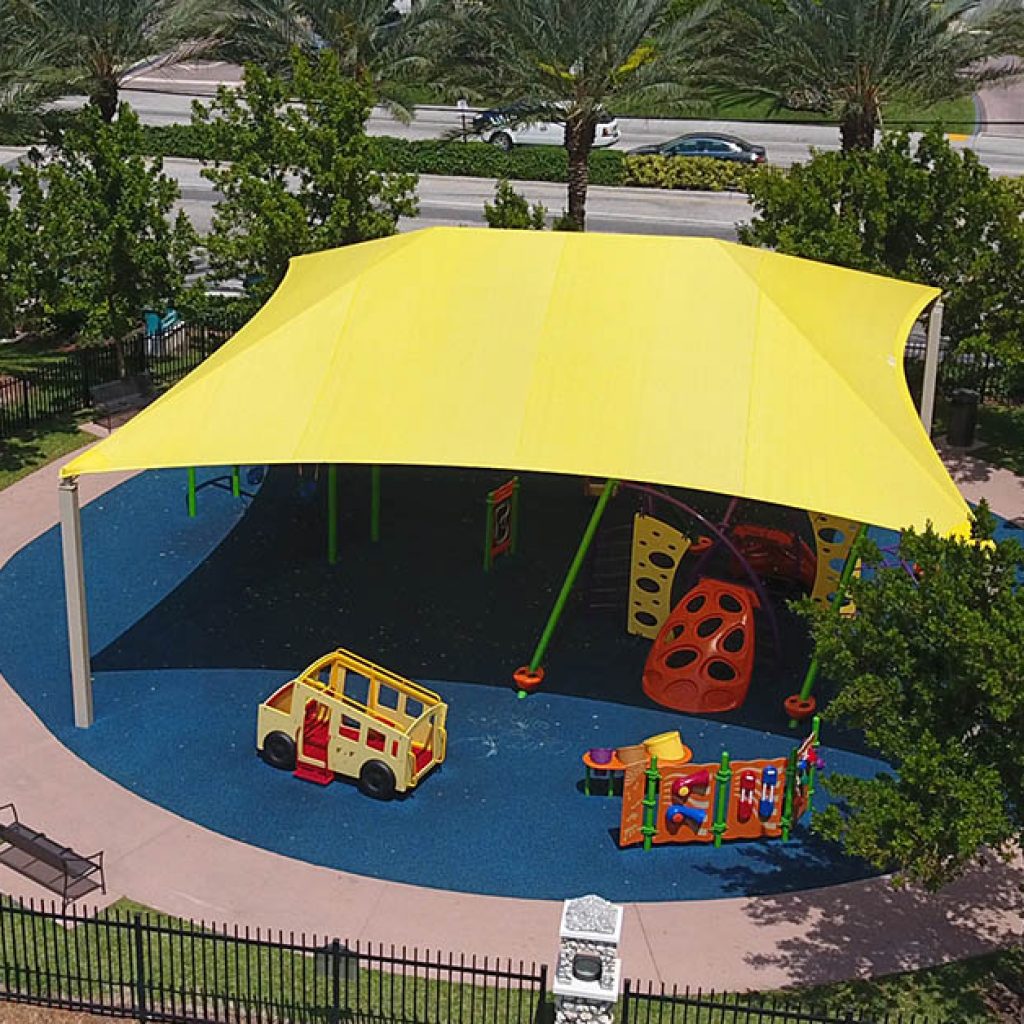yellow shade structure covering kid's playground