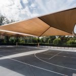 shade structure covering a basketball court