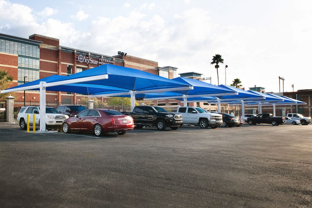 blue shade structure in a parking lot