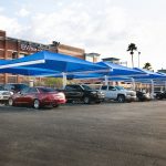 blue shade structure in a parking lot