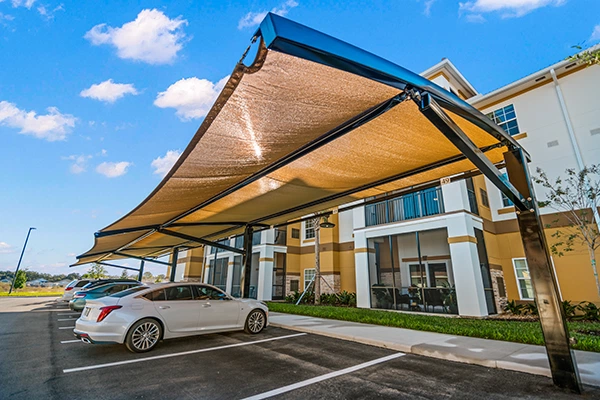 outdoor-shade-over-parking Parking shade structures protect residents’ vehicles from the harsh effects of the sun.