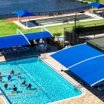 Residents of Tara Golf & Country Club enjoy sun shades at their pool and fitness courts.